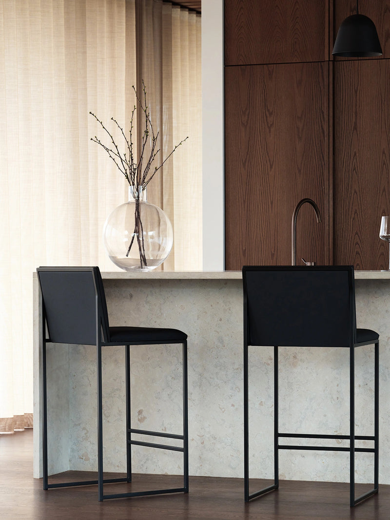 Ebba bar stools in solid oak at a stainless steel kitchen island