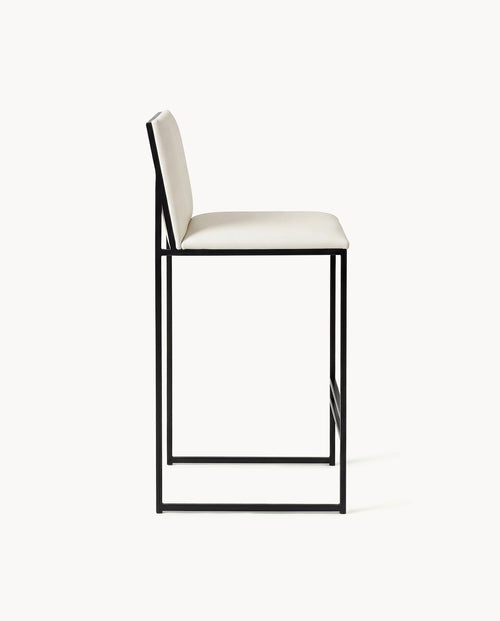 Bar Stool Philip featuring a black frame and ivory leather cushion, ideal for kitchen islands and bar counters.