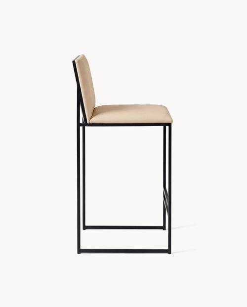 Bar Stool Philip with black frame and sand leather cushion, modern design for kitchen islands and bar counters.