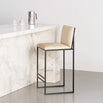 Philip Bar stool with black frame and sand leather seat, ideal for modern minimalist interiors.