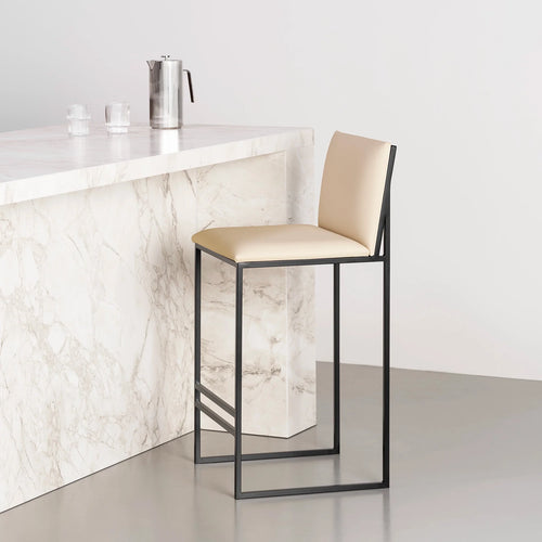 Philip Bar stool with black frame and sand leather seat, ideal for modern minimalist interiors.