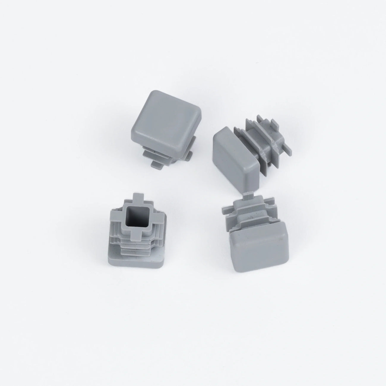 Four stylish gray plastic feet designed to protect floors and enhance everyday living with lasting beauty.