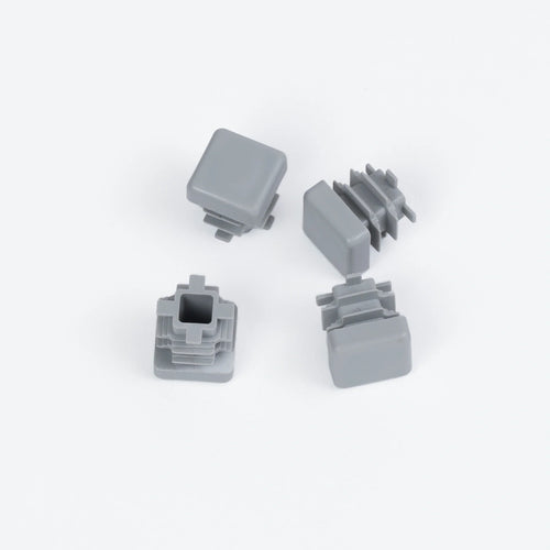 Four stylish gray plastic feet designed to protect floors and enhance everyday living with lasting beauty.