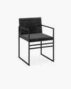 Sella dining chair in black velvet with sleek black metal frame, perfect for elevating dining room style and comfort.