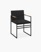 Sella dining chair in black with jade leather seat and coffee bean accents, perfect for stylish dining rooms.