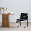 Sella dining chair in black velvet, designed for luxury comfort in modern dining room settings.