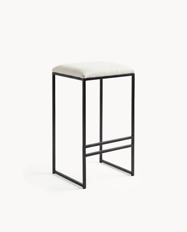 Bar Stool Svea by Crea with black frame and ivory bouclé seat, studio view