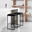 Svea black bar stools featuring a stylish black bouclé seat and a sleek black frame, ideal for modern high seating.