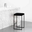 Svea Bar stool in black with bouclé seat, featured against a marble countertop, perfect for stylish high seating.