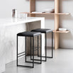 Svea bar stool in black with smooth leather seat, perfect for modern kitchen islands or high tables.