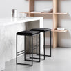 Svea bar stools in black velvet with a sleek black frame, perfect for modern kitchens and high tables.