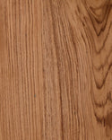 Close-up of a teak wooden surface with visible grain and texture