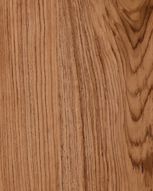Close-up of a teak wooden surface with visible grain and texture