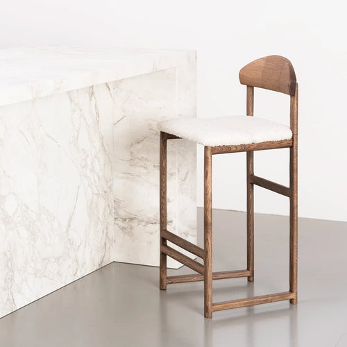 Ted bar stool in dark oak with ivory bouclé seat, perfect for kitchens and bar areas.