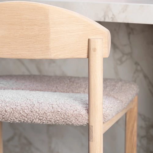 Ted bar stool with solid oak frame and greige bouclé seat, showcasing Scandinavian design and texture.