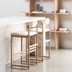 Ted bar stools with oak frame and ivory bouclé seats in modern kitchen setting, perfect for relaxed bar seating.