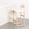 Ted oak bar stool with ivory bouclé seat, perfect for modern relaxed bar seating areas.