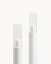 Candleholder Thomas set of 2, white frame, featuring clear glass and lit candles in elegant design.