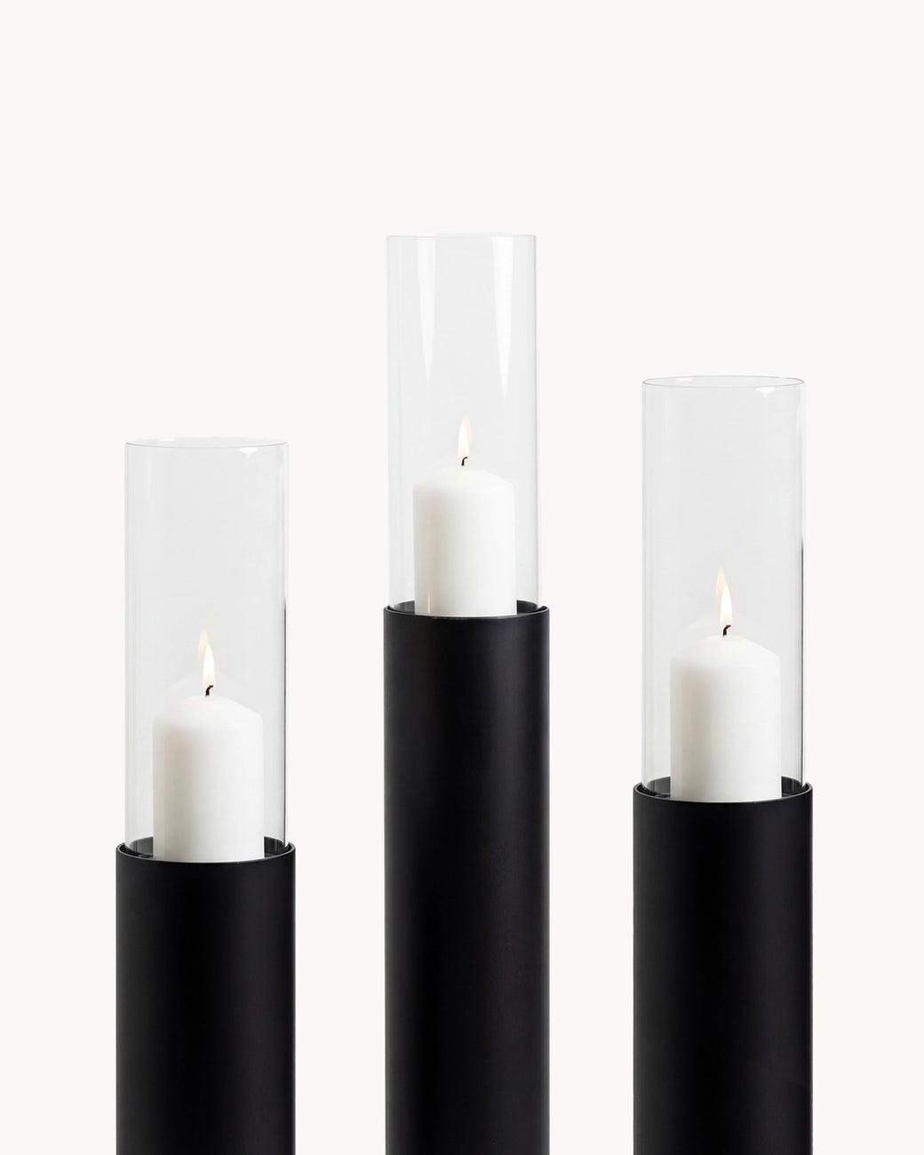 Candleholder Thomas set of 3 in black frame with clear glass cylinders and white candles, ideal for indoor decor.