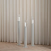 Beige floor candleholder set featuring three sculptural designs, perfect for modern Nordic interiors.