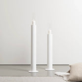 Candleholder Thomas – Set of 2 stylish white floor candleholders enhancing a minimalist home decor.
