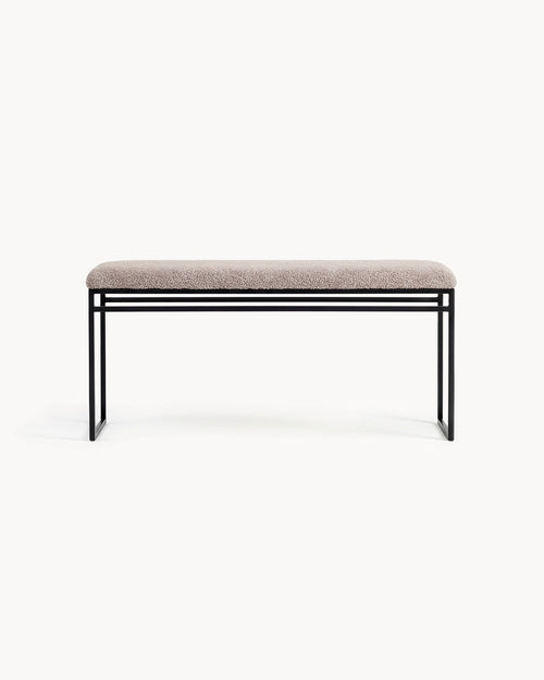 Bench Wilma with black frame and greige bouclé cushion for modern interiors.