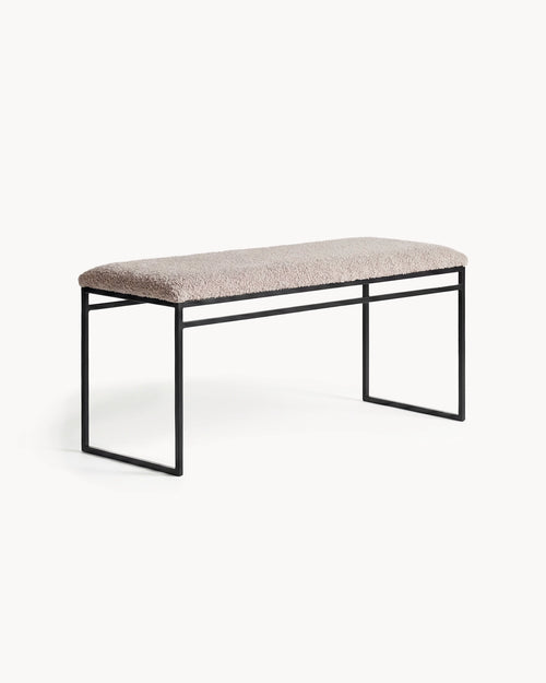 Bench Wilma with black frame and greige bouclé cushion, adding modern elegance to any interior.