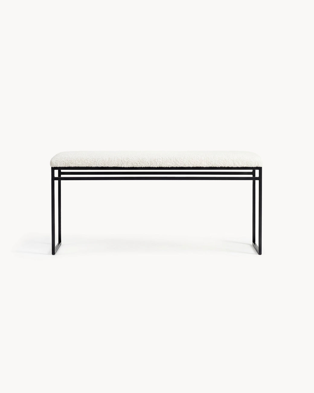 Bench Wilma with black frame and ivory bouclé cushion for stylish hallways and entryways.