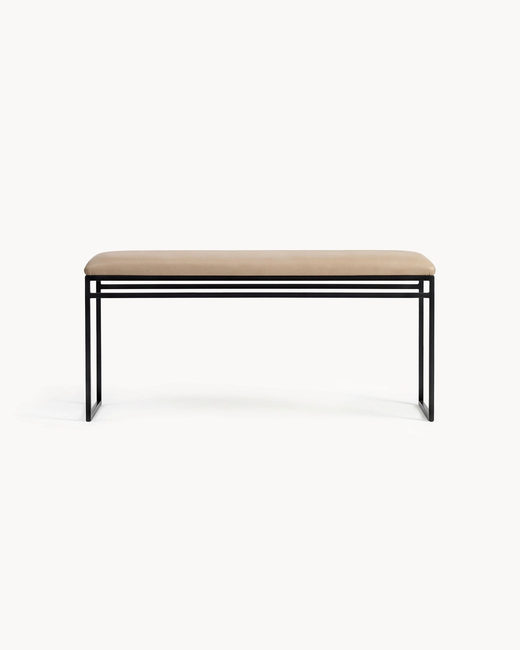 Bench Wilma with black frame and latte leather cushion, showcasing modern Scandinavian design.