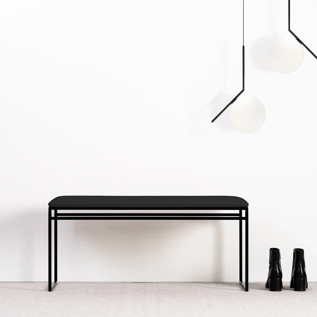 Wilma Bench in black with vegan leather seat, showcasing a modern minimalist design for contemporary spaces.