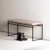 Wilma bench in black with greige bouclé, showcasing modern design and soft tones, perfect for serene interiors.