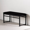 Wilma wood bench in black oak with black bouclé upholstery, ideal for minimalist and modern interior spaces.