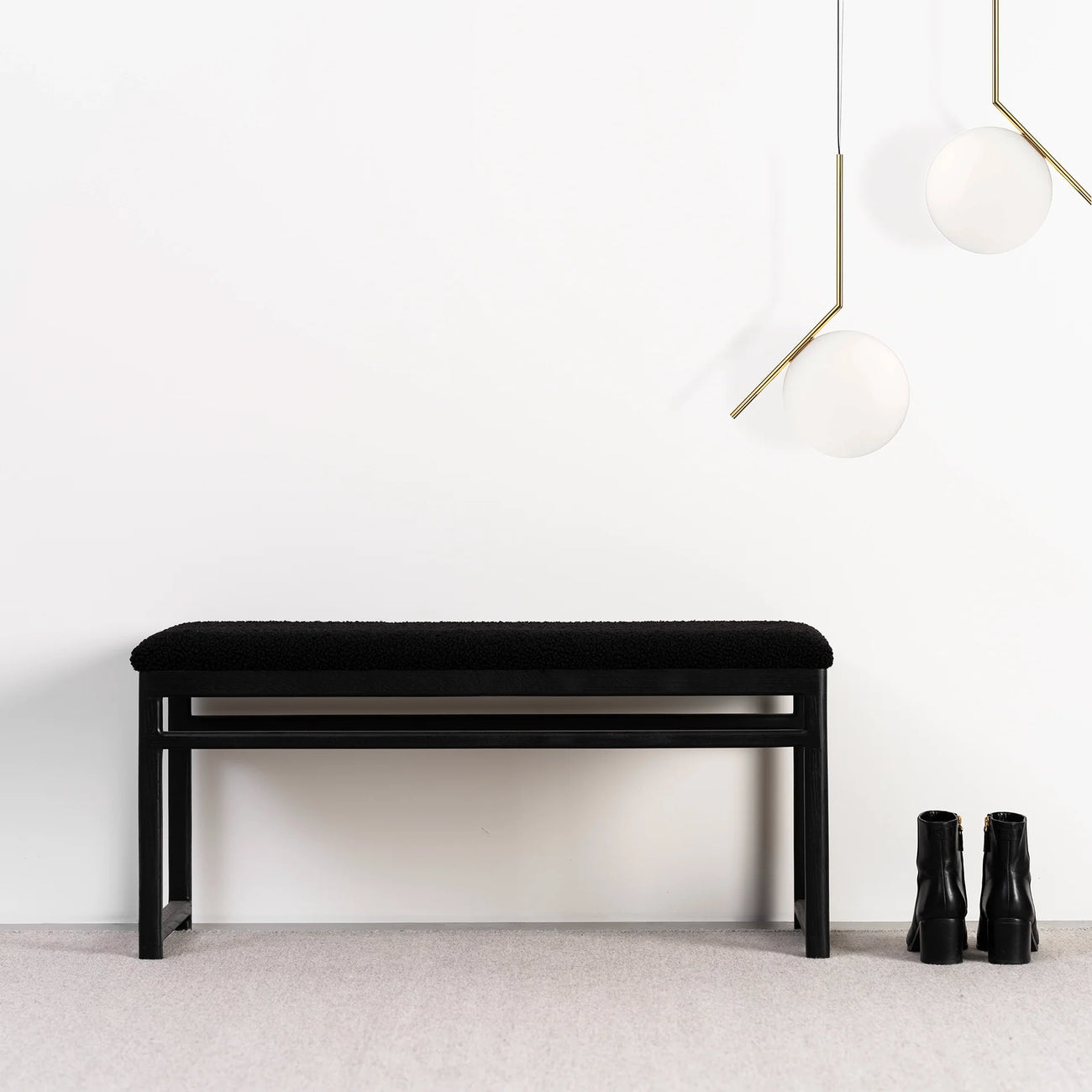 Wilma wood bench in black oak with black bouclé upholstery, stylish minimalist design, perfect for modern interiors.