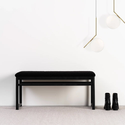 Wilma wood bench in black oak with black bouclé upholstery, stylish minimalist design, perfect for modern interiors.