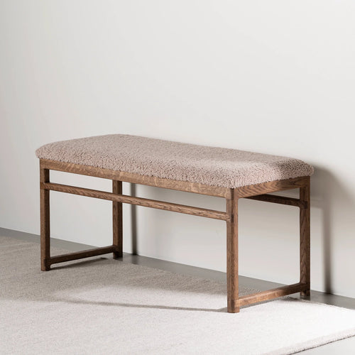 Wilma wood bench in dark oak with greige bouclé upholstery, ideal for modern interior spaces.