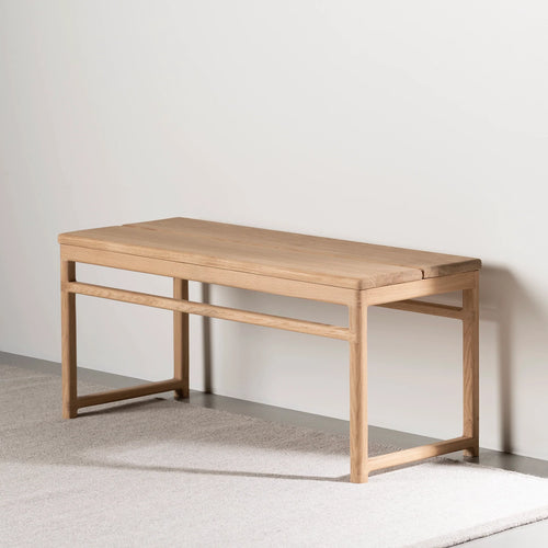 Wilma wood bench in solid oak featuring a minimalist Scandinavian design, ideal for hallways, bedrooms, or reading nooks.